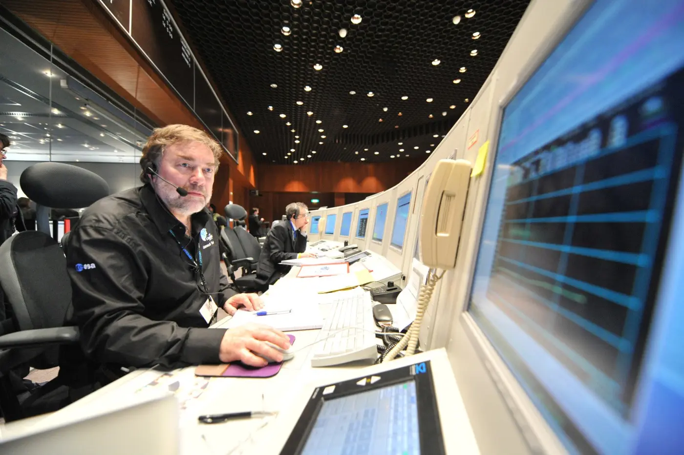 Richard Francis at a mission control console during spacecraft operations