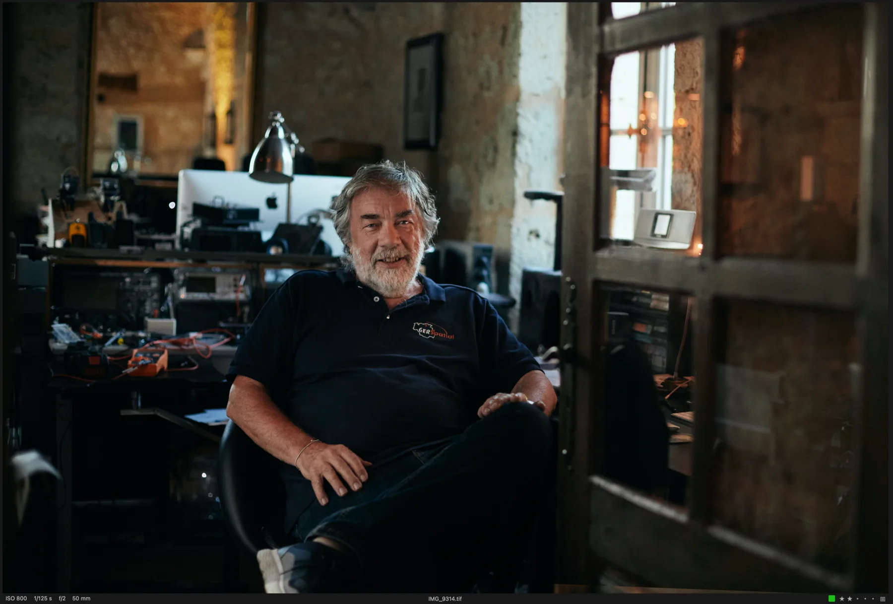 Richard Francis in the GerSpatial workshop, surrounded by electronics and computers